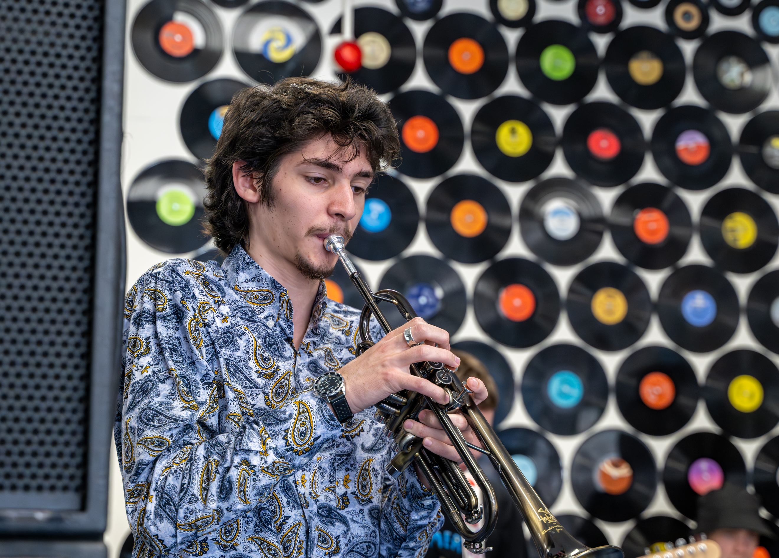 Student plays the trumpet during rehearsal 