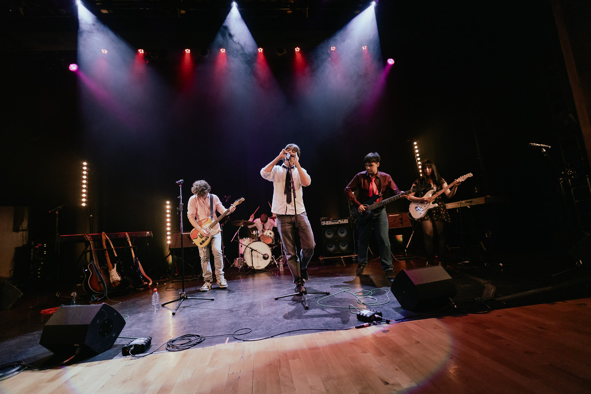 A band of Music students perform on stage.
