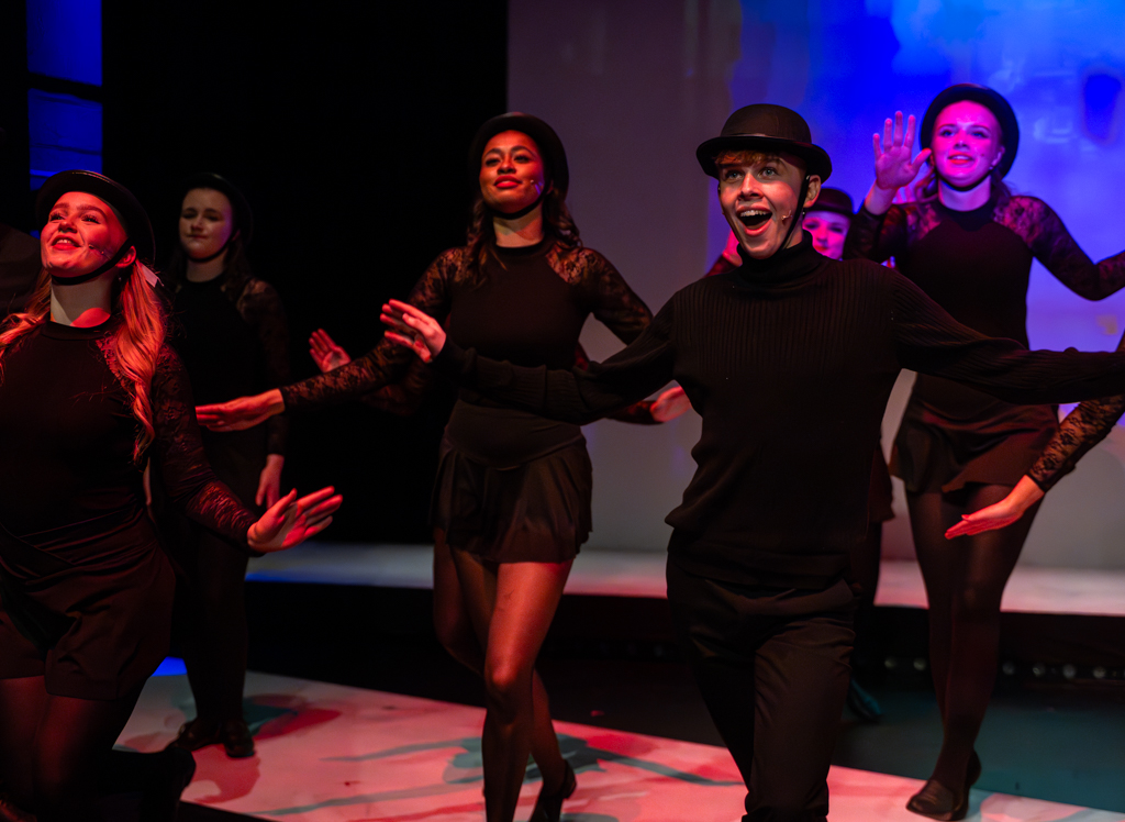 Students perform a jazz routine.