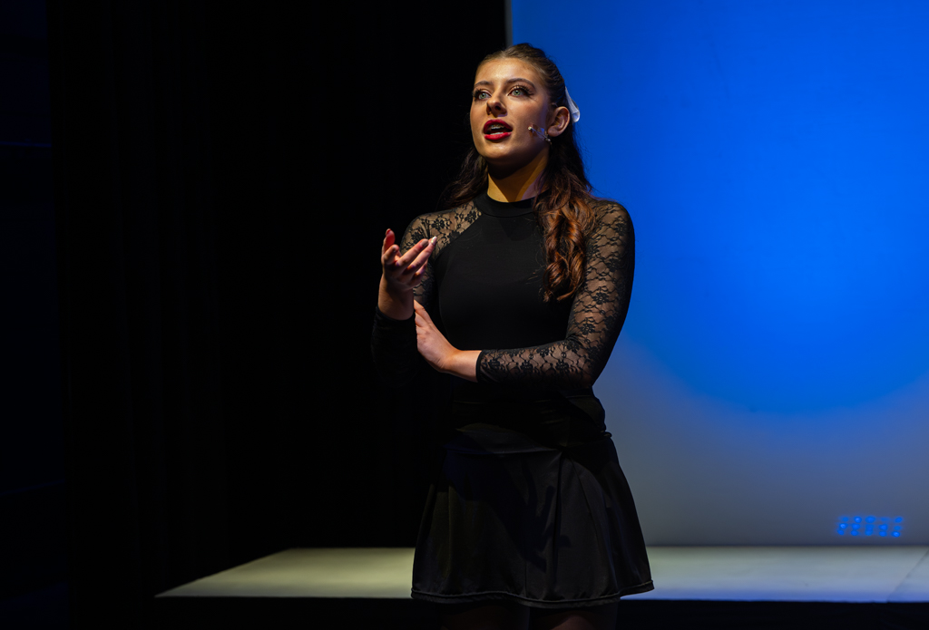 Musical Theatre student stands gazing out into the audience.